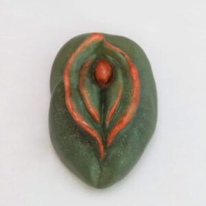 A green leaf with orange lines on it.