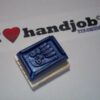 A rubber stamp with the hands of someone who is holding something.