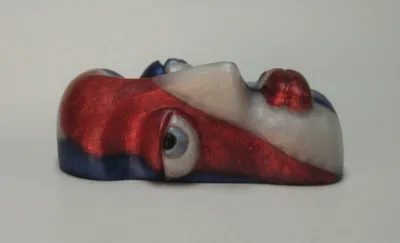 A red, white and blue sculpture of an eye.