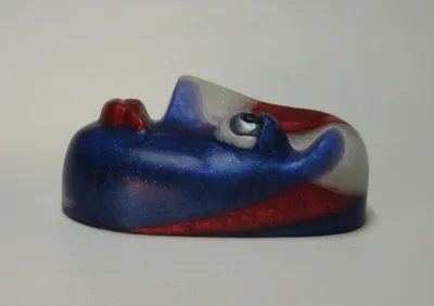 A blue and red object sitting on top of a table.