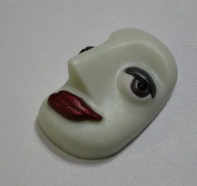 A white face with red lips on top of it.