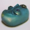 A green face with two eyes and a nose.
