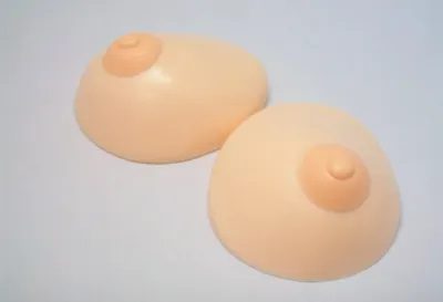 A pair of breast implants sitting on top of a table.