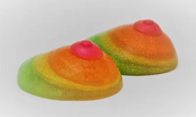 Two colorful cookies with a pink heart on top.