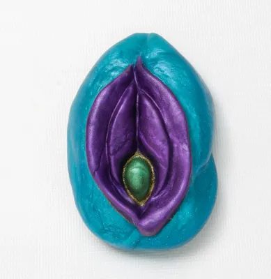 A blue and purple object with an open condom.
