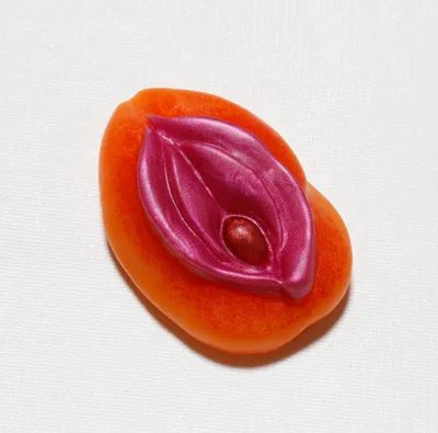 A piece of fruit with an erotic design on it.
