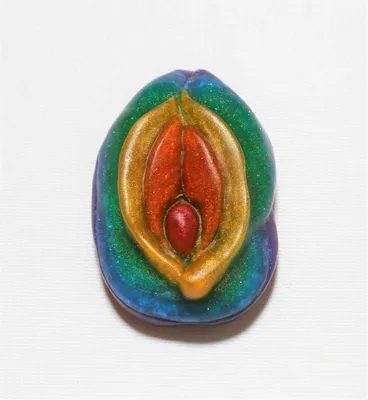 A colorful ceramic sculpture of an egg shell.