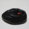A black object with one red ball in it.