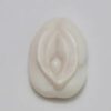 A white object with a large, feminine breast.