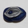 A blue and silver leaf shaped bead.