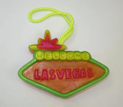 A neon sign that says " welcome las vegas ".