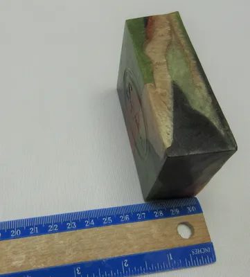 A piece of wood with a ruler next to it