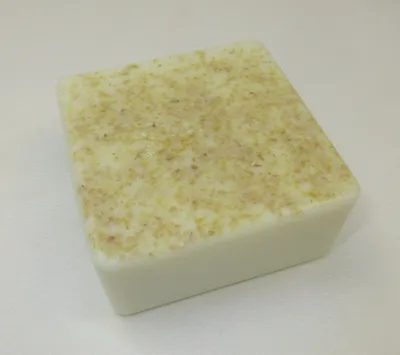 A square soap with some type of white substance