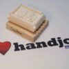 A rubber stamp sitting on top of a book.