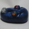 A blue object with some kind of face on it