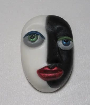 A black and white face with red lips.