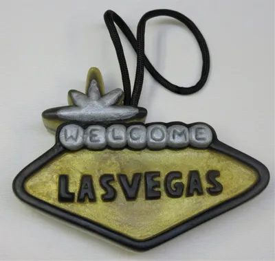A yellow and black sign that says " welcome las vegas ".