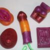 A variety of different colored soaps on top of each other.