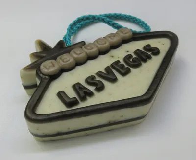 A las vegas sign ornament is shown on top of a white background.