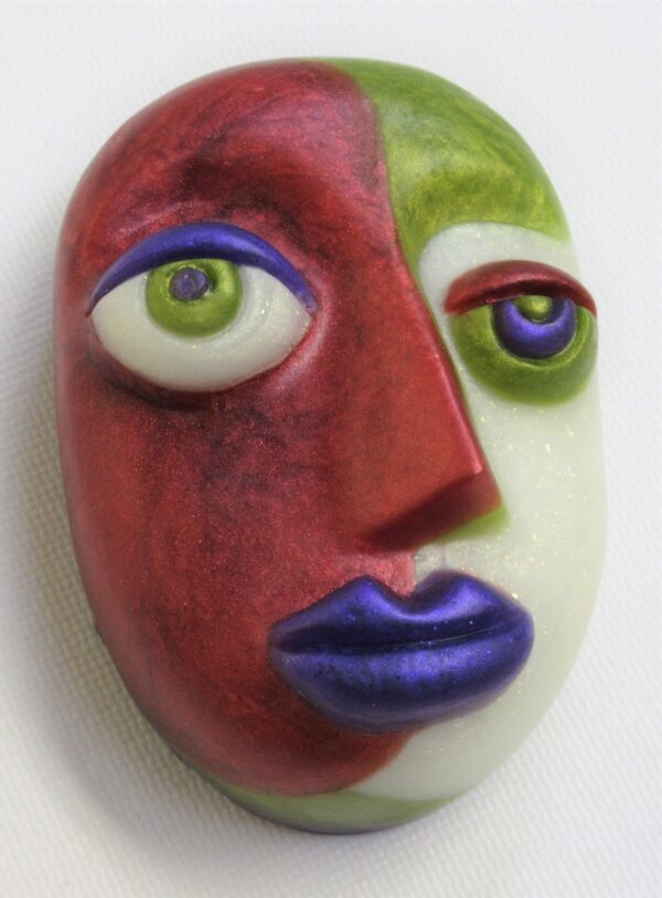 A red and green face with blue eyes.