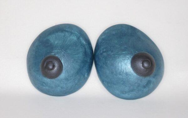 A pair of blue breasts with black nipples