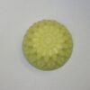 A yellow soap sitting on top of a counter.