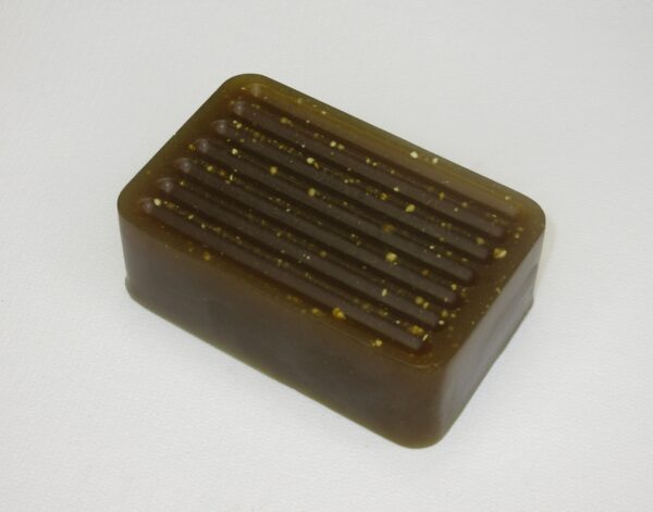A soap bar with some brown and yellow lines