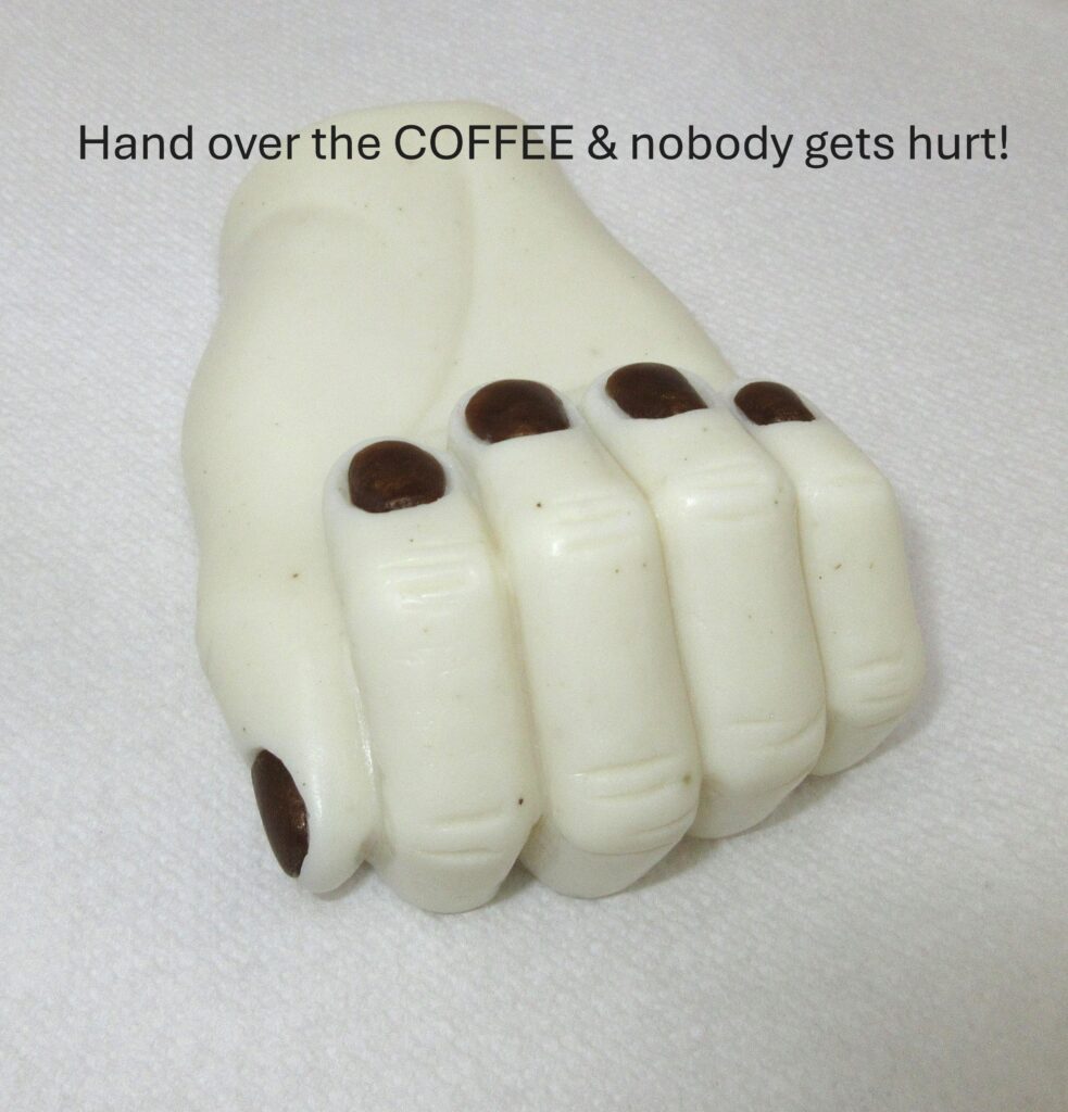 White chocolate fist with humorous coffee text.