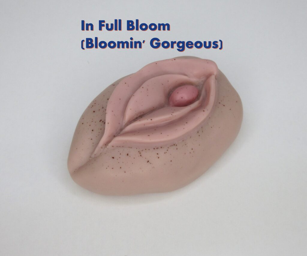 Pink soap with floral design and text.